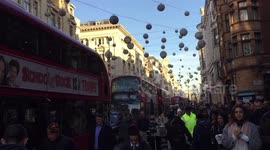 Fake snowfall delights confused shoppers on Oxford Street