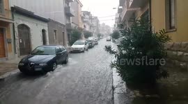 Severe rainstorm floods road in southern Sicily