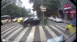 Out-of-control reversing car smashes into parked vehicle