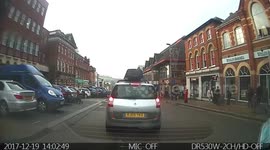 Woman bumped by reversing car