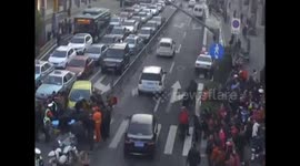 Good Samaritans lift car up to free trapped schoolboy