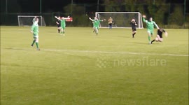 Defender drags opponent off pitch by jersey's collar