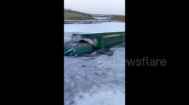 Transport lorry gets stuck in frozen river