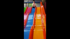 Mum and baby taking ages to get down slide