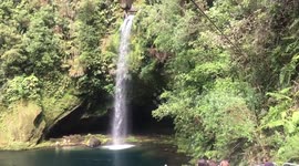 Slow motion jump from 30 meters waterfall