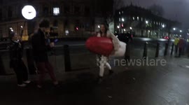 Women Walks With A Giant Tampon at the #FreePeriods protest