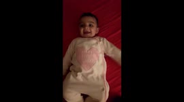 Baby is laughing when mama says baby.