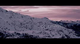 Stunning snow mountain aerial footage in the Alps