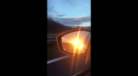 Sunset in car mirror