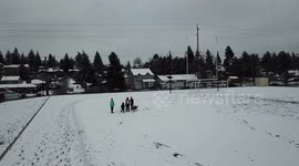 Santa Khan chasing a drone in the snow