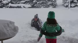 Father and daughter bellyflop into 4ft of snow in Erie, Pennsylvania