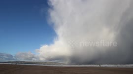 Huge winter storm cell over Northern Ireland beach