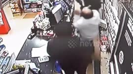 CCTV shows hero shopkeeper using karate skills to disarm gunman