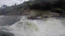 Kayaker catches football mid-air whilst falling of a 12 foot waterfall