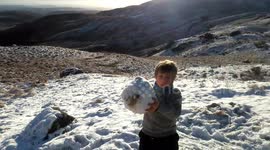 Plucky Brit family enjoy picnic as snow falls on icy UK