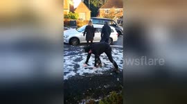 Midlands man struggles to stand up on icy pavement