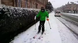 Glasgow shopper skis down street with milk and bread