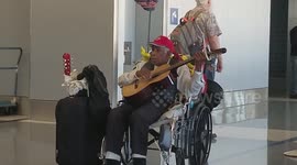 Man sings about his love for  United Airlines at Los Angeles International Airport