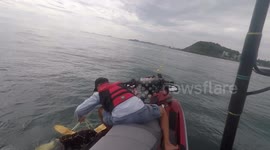 Jet ski rider frees sea turtle tangled in shark net