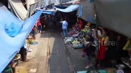 Mesmerising view from Thailand train as it passes through 'world's most dangerous market'