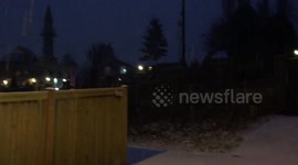 Pan shot of snow falling in Seattle on Christmas Eve