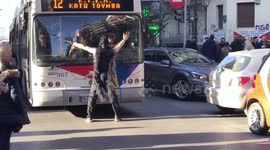 New Year's Eve Celebrations - Masked Santa blocks traffic dancing on