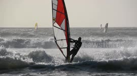 UK windsurfers, swimmers brave New Year's Day cold