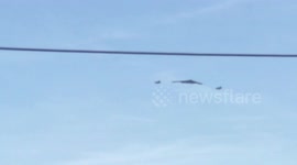 Extremely rare B2 stealth bomber flyover with fighter escort