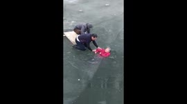 Amazing moment man rescues elderly woman trapped in icy river in China's Hebei