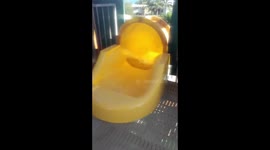 Man uses clingfilm (sandwich wrap) to keep his phone dry on waterslide