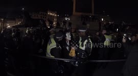 Anonymous protestor getting arrested by UK police in Trafalgar Square London