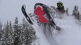 Jumping snowmobile into deep snow