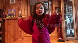 Cute kid shows how to put on your coat in one motion
