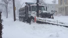 Snow ploughs clear Boston during massive storm