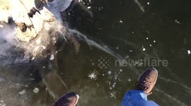 Man walks on frozen pond in Kansas
