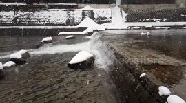 Snowing scene at the river in Japan Takayama town