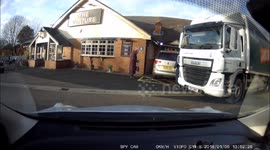 Helpful truck driver helps older driver out of parking space