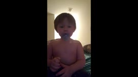 Two year old sings her little heart out.