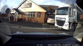 Mature lady struggles to reverse from a parking space, even though there is plenty of room to exit the space next to a parked hgv