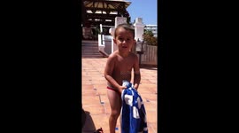 cute kid does accidental towel throwing magic