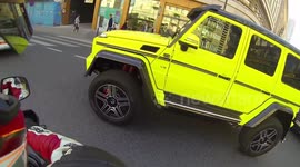 An angry brunette drives a Mercedes G500 4x4^2 (squared)