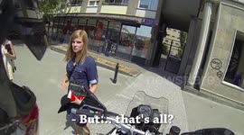 Cute blonde gives a rider a high five