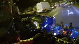Driver ignores a rider and tries to push him off the road
