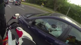 Driver is reading a newspaper in the car