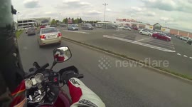 Enduro motorcycle goes through a curb at the shopping mall