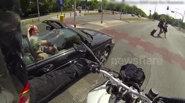 Girl puts sunscreen on guy's head in an convertible