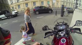 Hot lady distracts a motorcycle rider