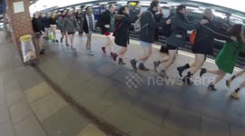 Passengers do the conga on No Trousers Tube Ride day in London