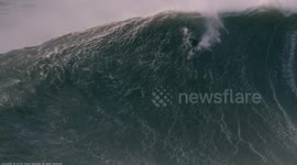 Surfer rides spectacular giant wave in Portugal's Nazaré