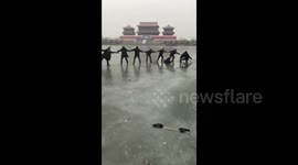 Human chain saves mum and two children trapped in icy river